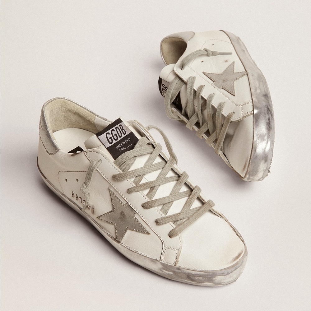 Golden Goose 
Super-Star with silver sparkle foxing and metal stud lettering